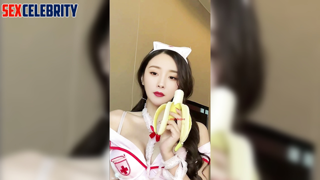 Chinese Yang Mi (中国人杨幂) as a nurse eats a banana 护士吃香蕉 [PREMIUM]