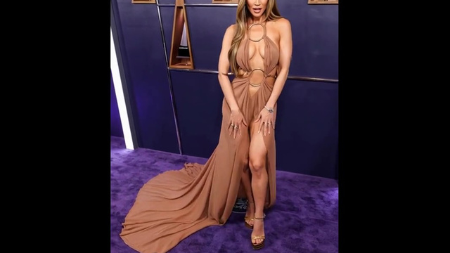 Deepfake. Jennifer Lopez in a beautiful dress sticks out her tongue in a sexy way